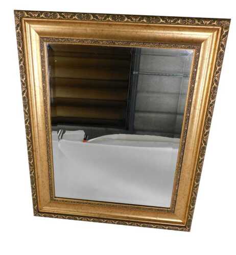 A gilt wall mirror, with bevelled plate, 66cm x 54cm overall.