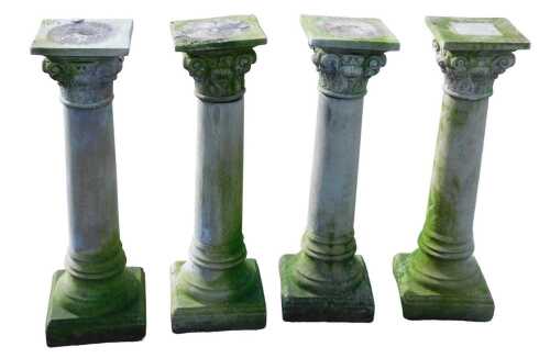 A set of four composite design stone garden columns, 80cm high, 26cm wide, 21cm deep.