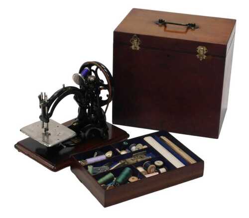 A late 19th/early 20thC Willcox and Gibbs Figure of Eight sewing machine, of small proportion,...