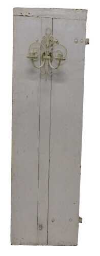 A 19thC Continental cream painted door, mounted with a wrought iron wall sconce, possibly French,...