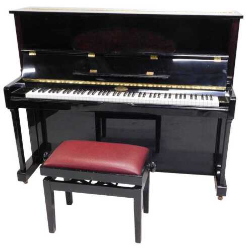 A Kemble London overstrung upright piano, in black, with oval inlay finish section, 120cm high,...