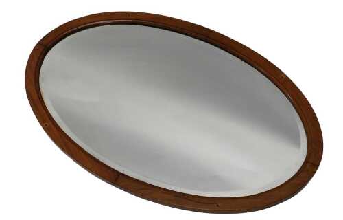 An early 20thC oval mirror, with bevelled glass, 52cm x 83cm.