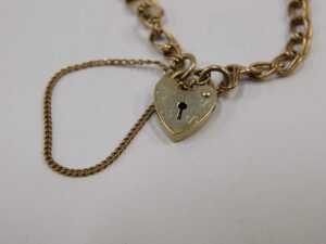A 9ct gold bracelet, with double curb links, 18cm long, safety chain and heart shaped padlock, 2.... - 2