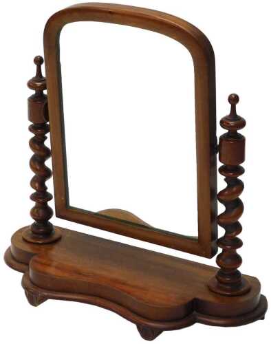 A Victorian mahogany table mirror, the arched glass flanked by barley twist columns, on a shaped...