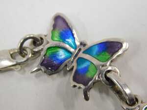 A Mexican butterfly bracelet, formed as seven butterflies, each enamel decorated, white metal... - 2