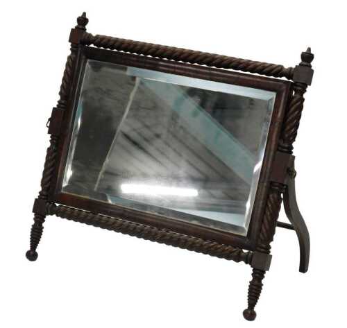 A Regency mahogany table mirror in the manner of George Bullock, the rectangular glass in...