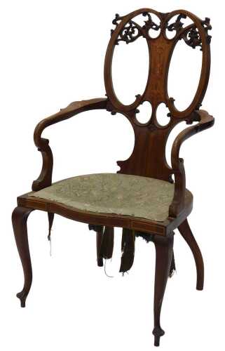A 19thC mahogany Manwaring style elbow chair, with an elaborate pierced scroll splat centred by...