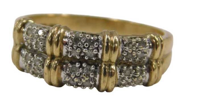 A 9ct gold double row dress ring, formed as three white metal sections, each set with four tiny...