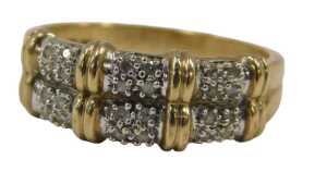 A 9ct gold double row dress ring, formed as three white metal sections, each set with four tiny...