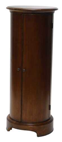 A circular mahogany finished bathroom cupboard, with hinged doors revealing an interior set with...