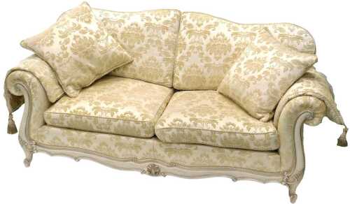 A lounge suite, comprising three seater settee, armchair and footstool, in cream material with...