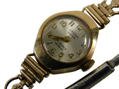 A 9ct gold cased Oriosa lady's wristwatch, with a silvered numeric dial, on a gold plated strap,...