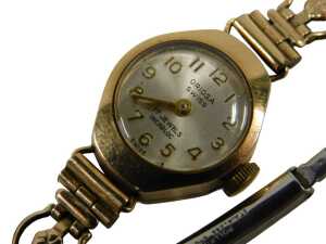 A 9ct gold cased Oriosa lady's wristwatch, with a silvered numeric dial, on a gold plated strap,...