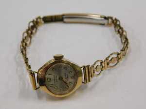 A 9ct gold cased Oriosa lady's wristwatch, with a silvered numeric dial, on a gold plated strap,... - 2