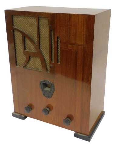 A mid 20thC walnut cased radio, on squat feet, 46cm high. WARNING! This lot contains untested or...