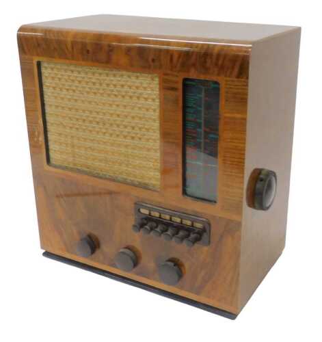 A mid 20thC walnut cased Ultra 209 radio, number BGB772, 42cm high. WARNING! This lot contains...