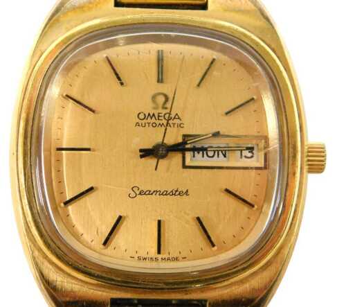 An Omega Seamaster automatic gent's wristwatch, with a gold coloured baton dial and date and day...