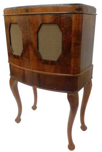 A 1930s Art Deco McMichael model 135 radio receiver, in walnut freestanding cabinet, with hinged...