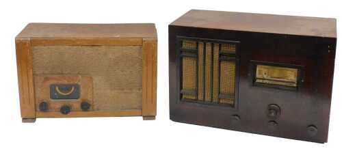 A mid 20thC walnut cased Bush AC11 valve radio, 34cm high, and a further valve radio. (2, AF)...