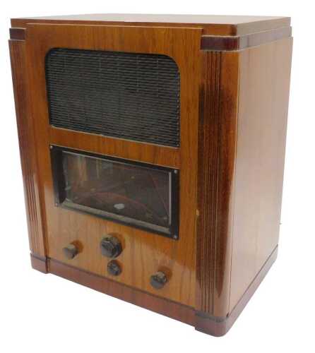 A mid-20thC walnut cased Marconi model 557 radio, in a walnut case, circa 1937, 50cm high....