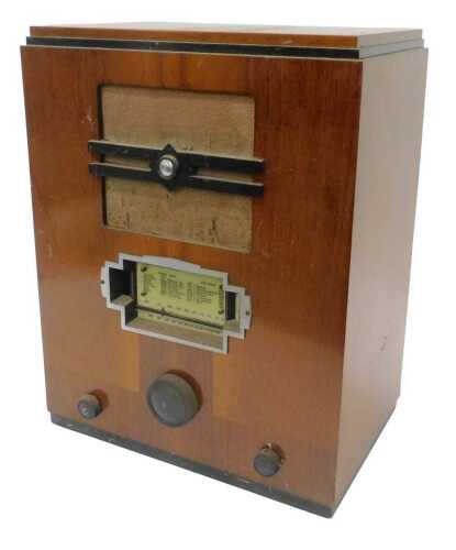 A mid 20thC walnut cased radio, 54cm high. WARNING! This lot contains untested or unsafe...