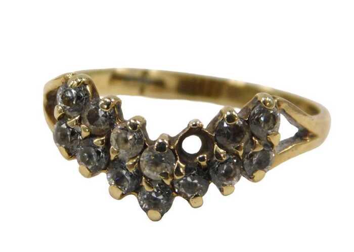A 9ct gold wishbone dress ring, with double layers of CZ stones, each claw set, on V splayed...