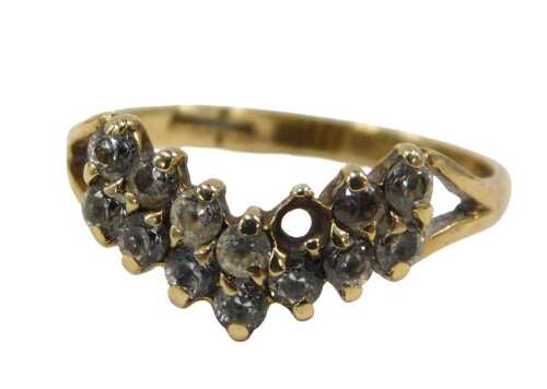 A 9ct gold wishbone dress ring, with double layers of CZ stones, each claw set, on V splayed...