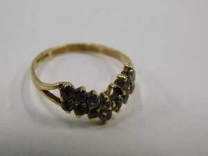 A 9ct gold wishbone dress ring, with double layers of CZ stones, each claw set, on V splayed... - 2