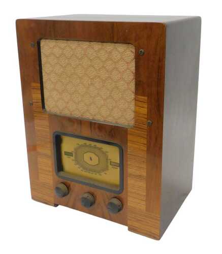 A mid 20thC walnut cased AC Wartime Civilian radio, 46cm high. WARNING! This lot contains...