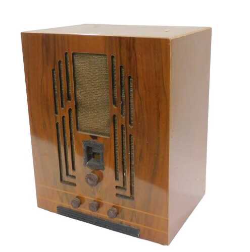 A mid 20thC walnut cased Westinghouse style tombstone radio, circa 1933, 46cm high. WARNING!...