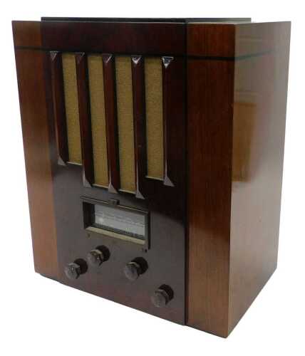 A mid 20thC walnut cased PYE style broadcast radio receiver, 51cm high. WARNING! This lot...