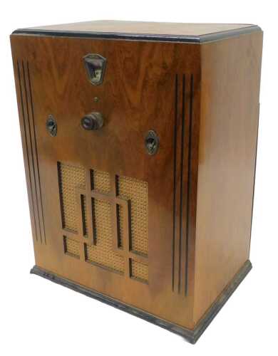 A mid 20thC walnut cased Magnadyne style tube radio, circa 1930, 46cm high. WARNING! This lot...