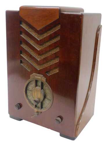 A mid 20thC walnut cased Mid West Corp radio, 51cm high. WARNING! This lot contains untested or...