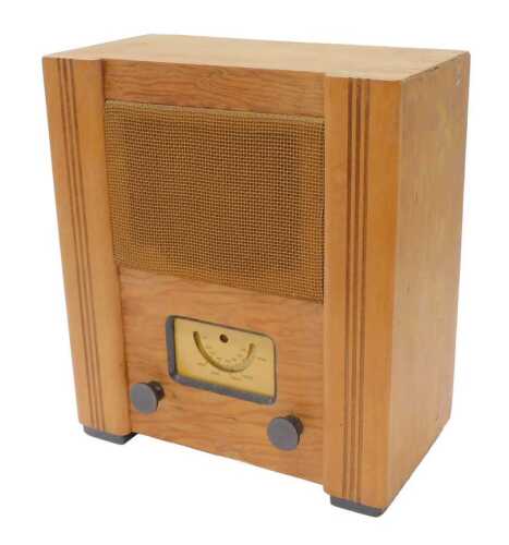 A mid 20thC Civilian radio receiver, circa 1944, 35cm high. WARNING! This lot contains untested...