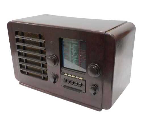 A mid 20thC Bakelite cased radio, EKCO A23 style, circa 1946, 34cm high. WARNING! This lot...
