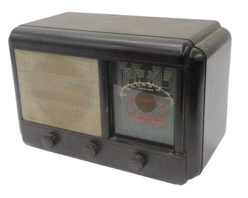 A mid 20thC Bakelite cased radio, with front tuning knops, 23cm high. WARNING! This lot contains...