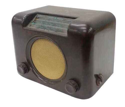 A mid 20thC Bakelite cased Bush radio, type DAC90A, 26cm high. WARNING! This lot contains...