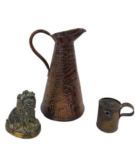 An early 20thC Joseph Sankey copper jug, of textured form, tapering body, beak spout, plain...