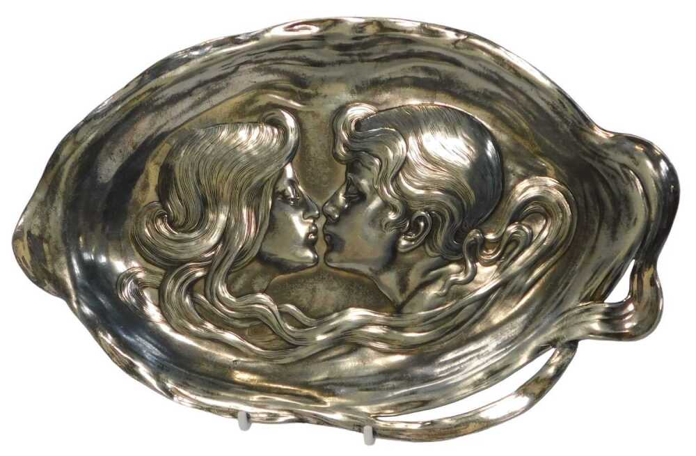 A WMF Art Nouveau metal dish, of oval waved form, decorated in relief ...