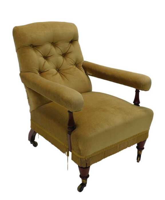 A 19thC mahogany framed library chair, with overstuffed back, arms and deep seat, with turned...