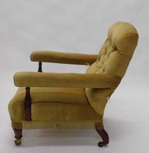 A 19thC mahogany framed library chair, with overstuffed back, arms and deep seat, with turned... - 2