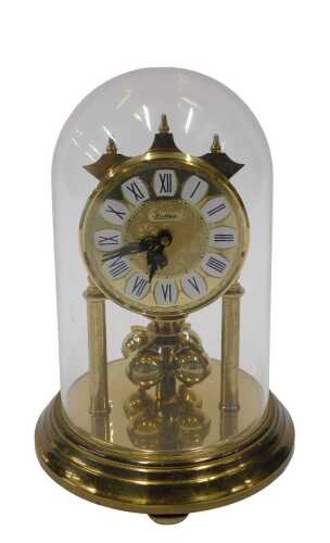 A 20thC Haller anniversary clock, with 8cm diameter dial on turned pillars, in domed case, 20cm...