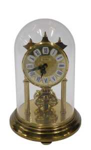 A 20thC Haller anniversary clock, with 8cm diameter dial on turned pillars, in domed case, 20cm...