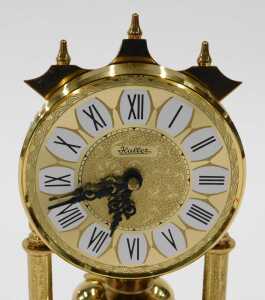 A 20thC Haller anniversary clock, with 8cm diameter dial on turned pillars, in domed case, 20cm... - 2