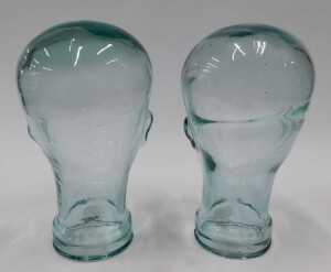 A pressed moulded glass head, 26cm high, and another similar. (2) - 4