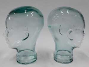 A pressed moulded glass head, 26cm high, and another similar. (2) - 5