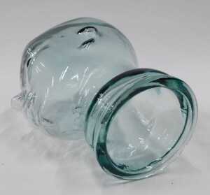 A pressed moulded glass head, 26cm high, and another similar. (2) - 6