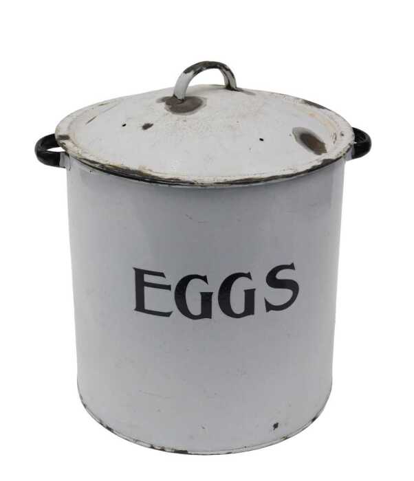 An early 20thC enamel bin and cover, marked EGGS, in black and white, with removable lid, 31cm...