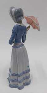 A Lladro figure of a lady with parasol, D6A, 31cm high (parasol loose), boxed. - 2
