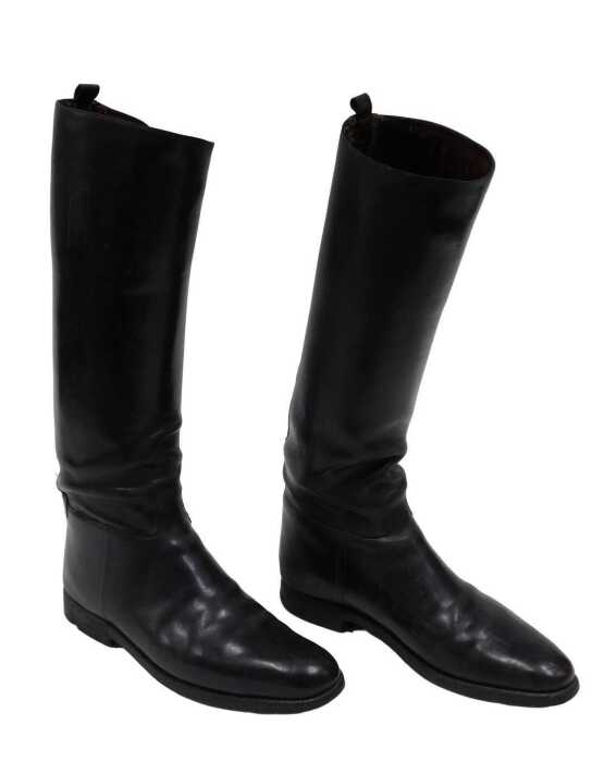 A pair of early 20thC black leather riding boots, numbered 29, 39cm high.